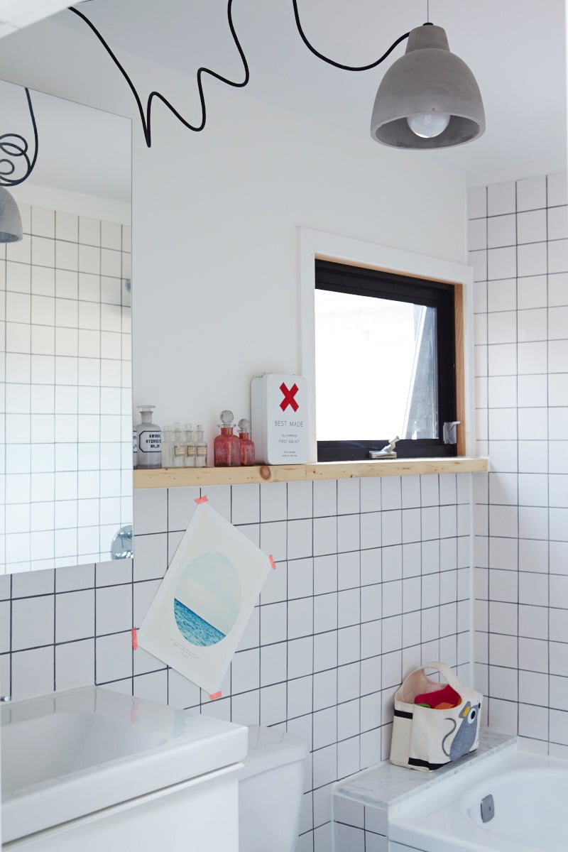 White tiles and graphics Bathroom Design Ideas