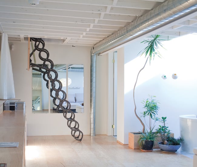 etractable ladder leads to the garden rooftop and deck