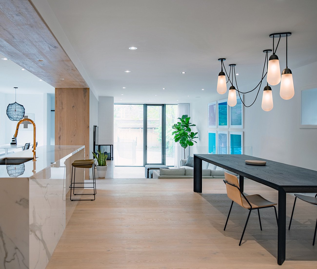 Kitchen and dining room with a black table