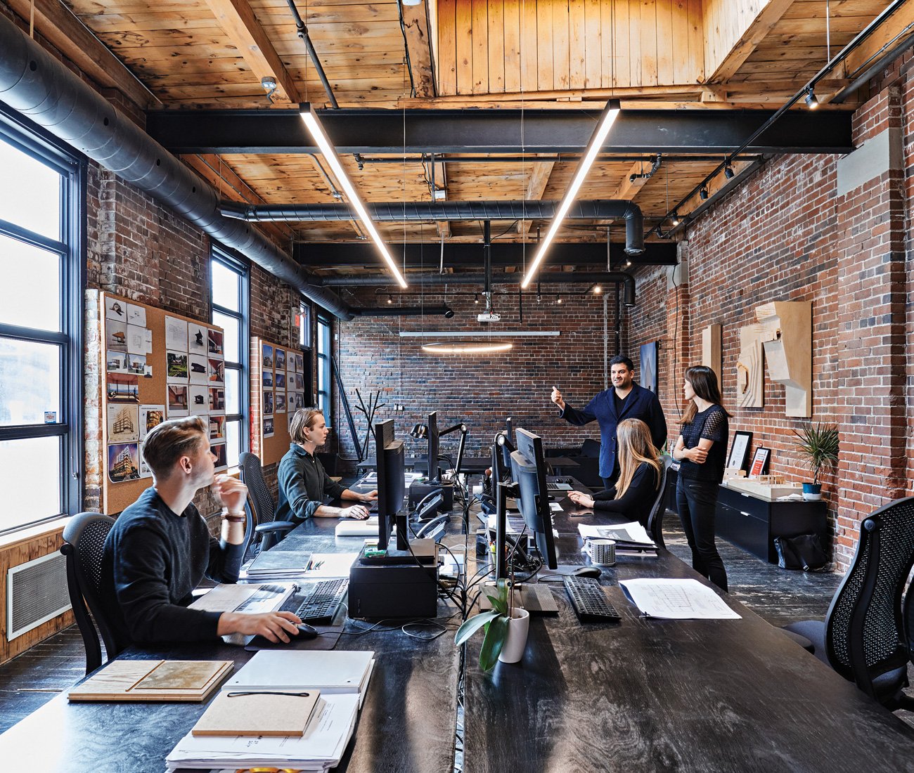 Architect Omar Gandhi with his team in his Toronto office. OG Architects
