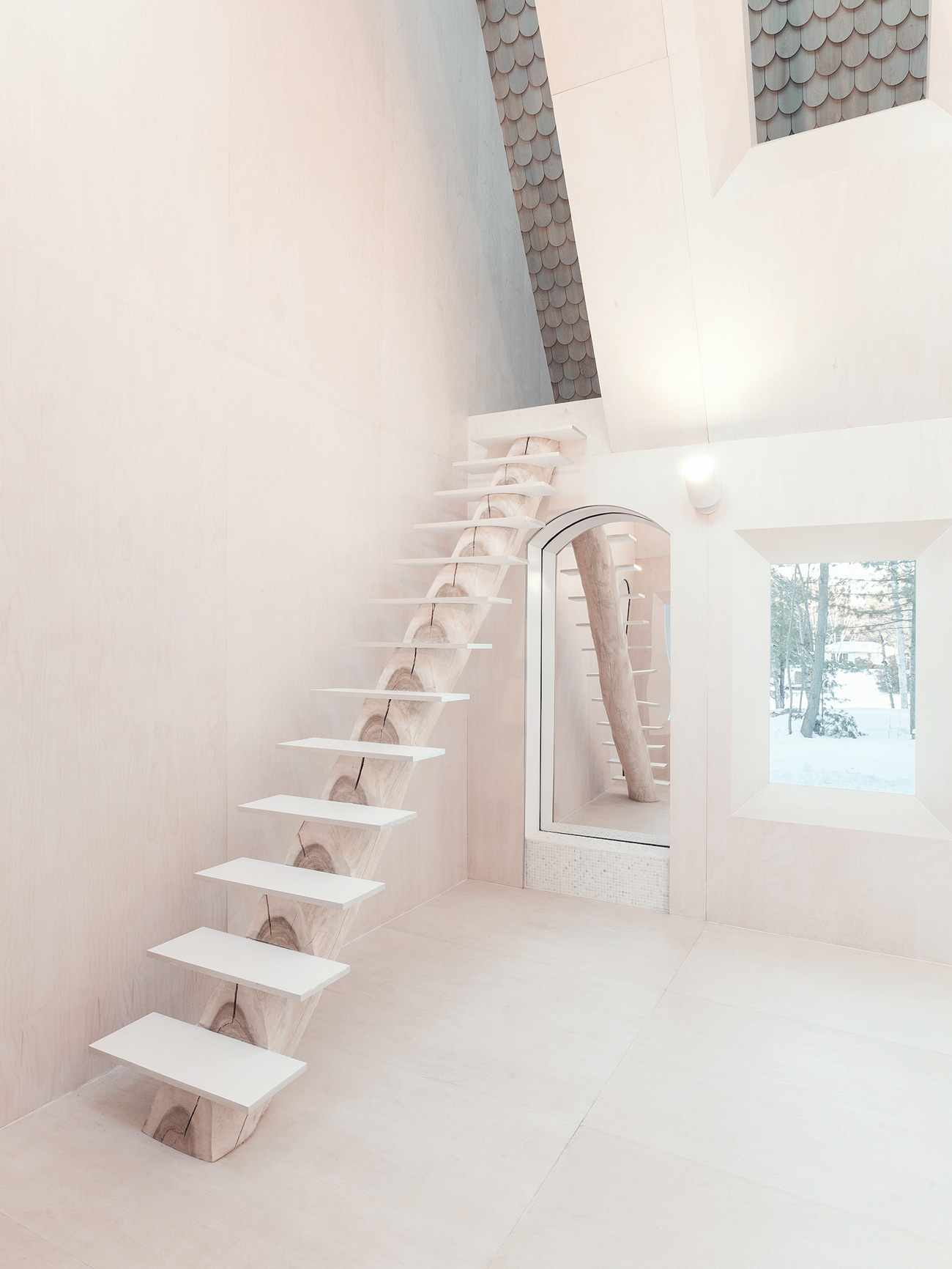A maple log staircase at a modern cottage