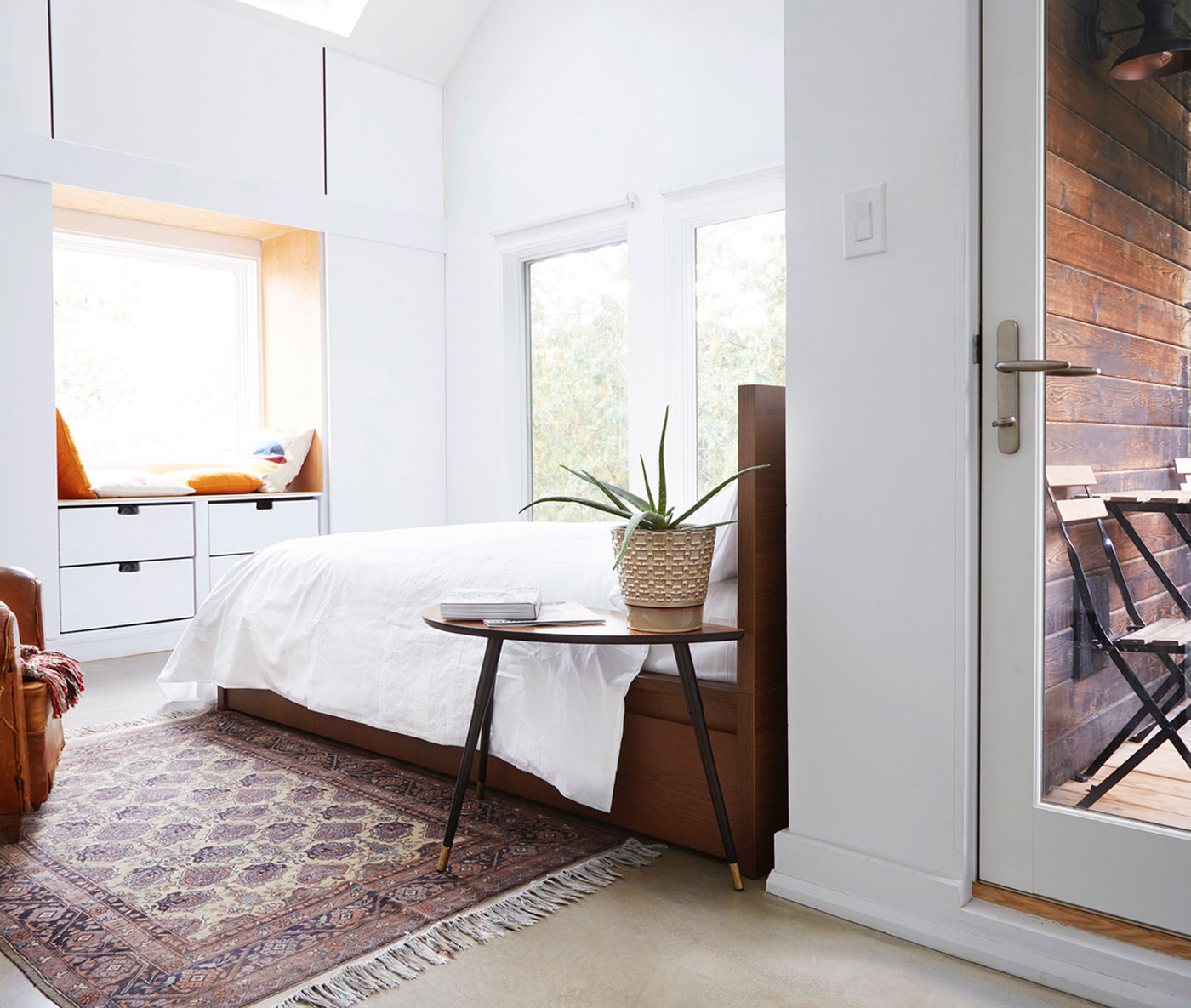 two skylights and three large windows, the bedroom is almost treehouse-like