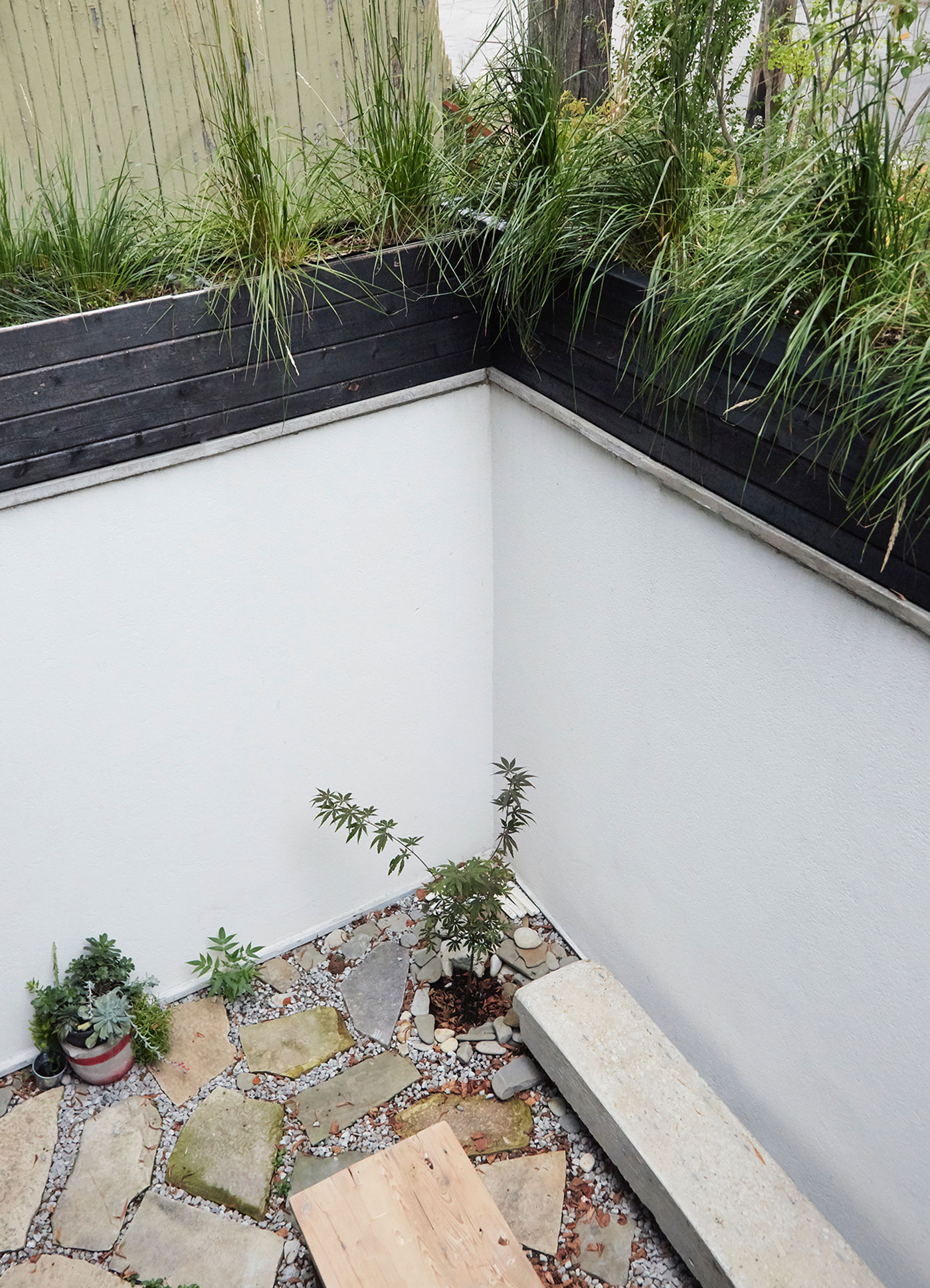 garden filled with stones and slabs sourced from former streetcar tracks
