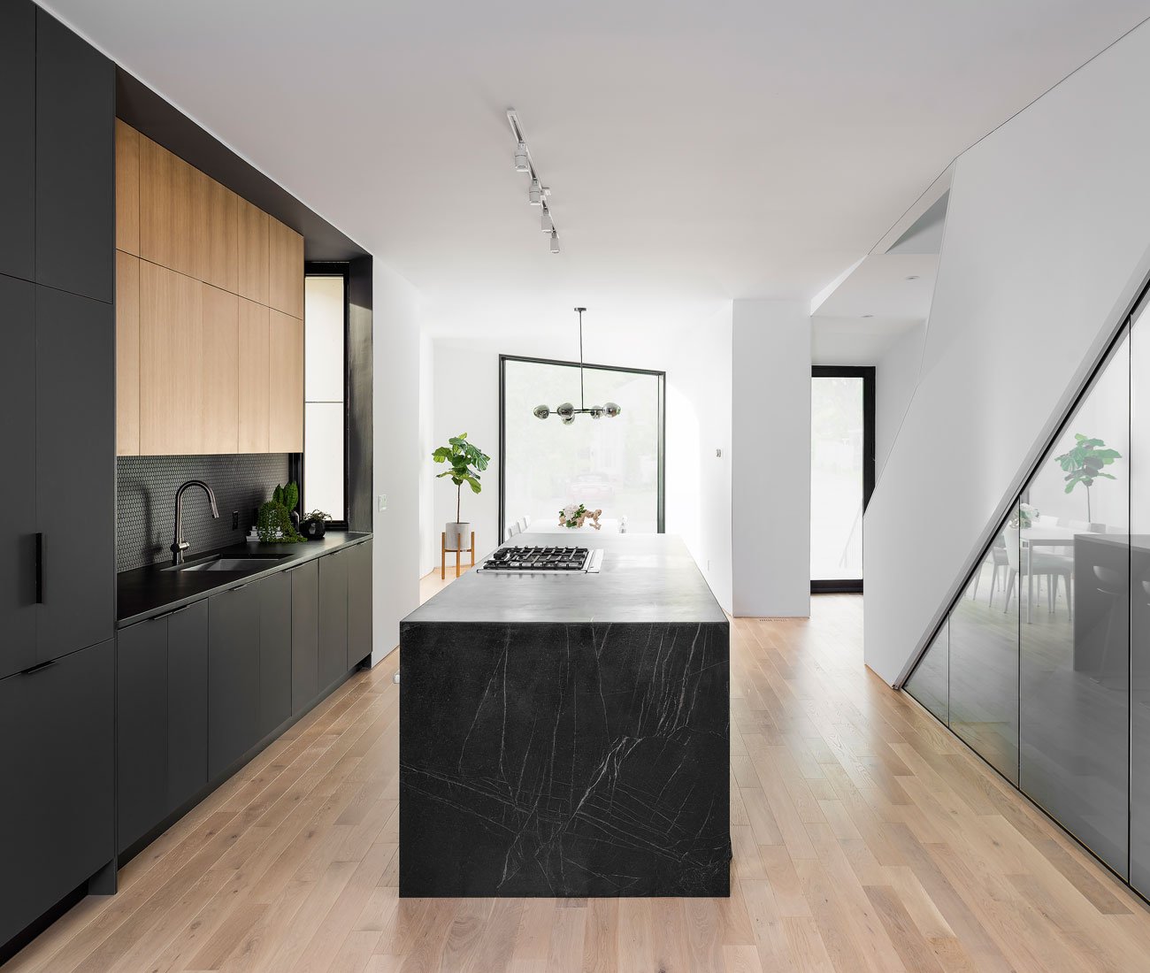 Phaedrus Studio Tesseract House Designlines Magazine Long Branch Home Custom kitchen with rift oak cabinets, 3.7-metre soapstone island, and solid white oak flooring. Phaedrus Studio Tesseract House