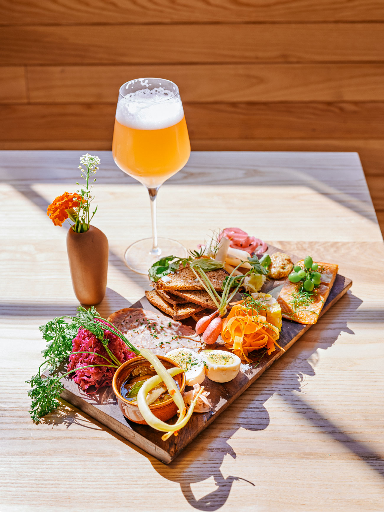 tray with some food and a fresh glass of beer