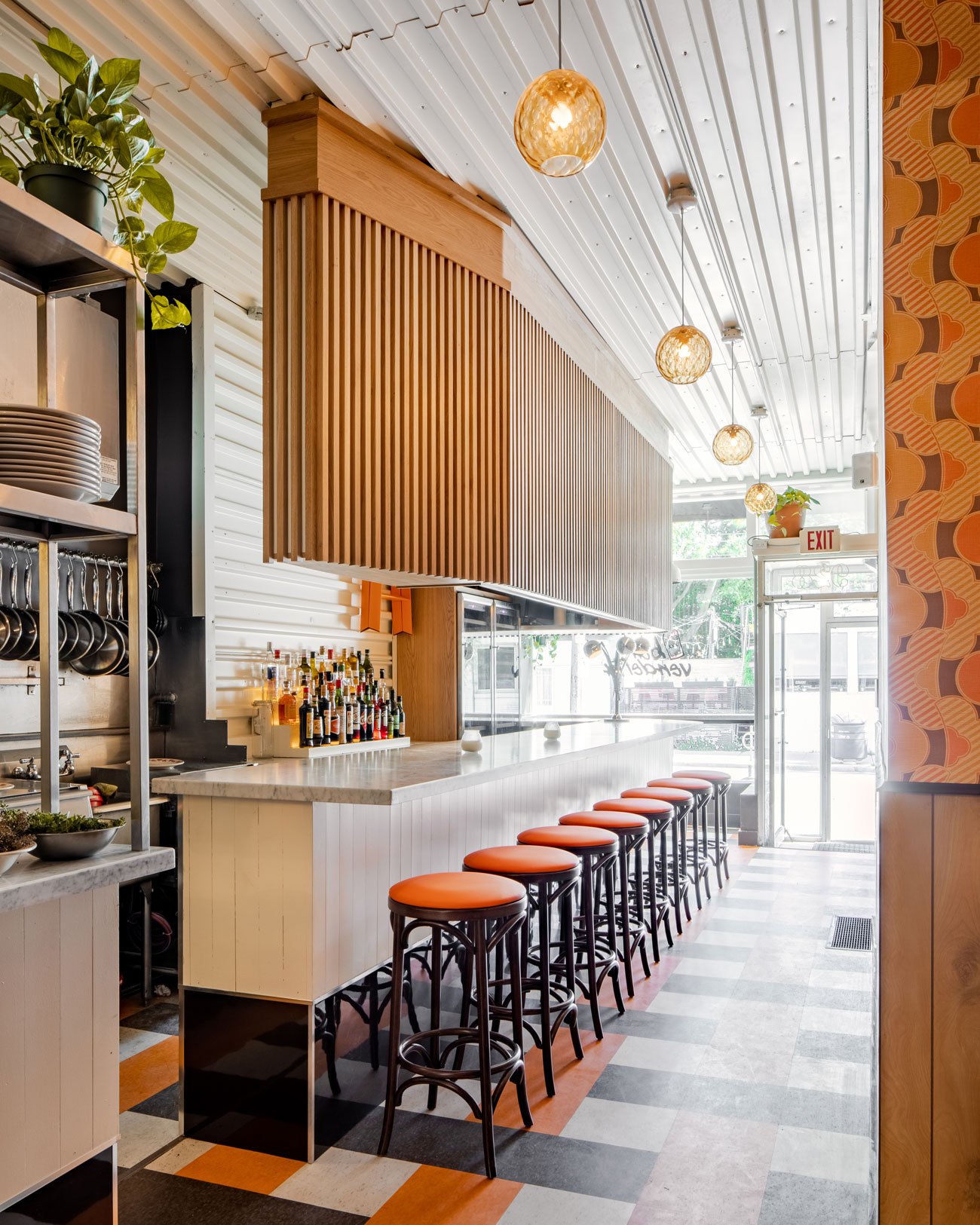 Bar Vendetta restaurant in Toronto by Interior Jen Agg's, stools near the bar counter.