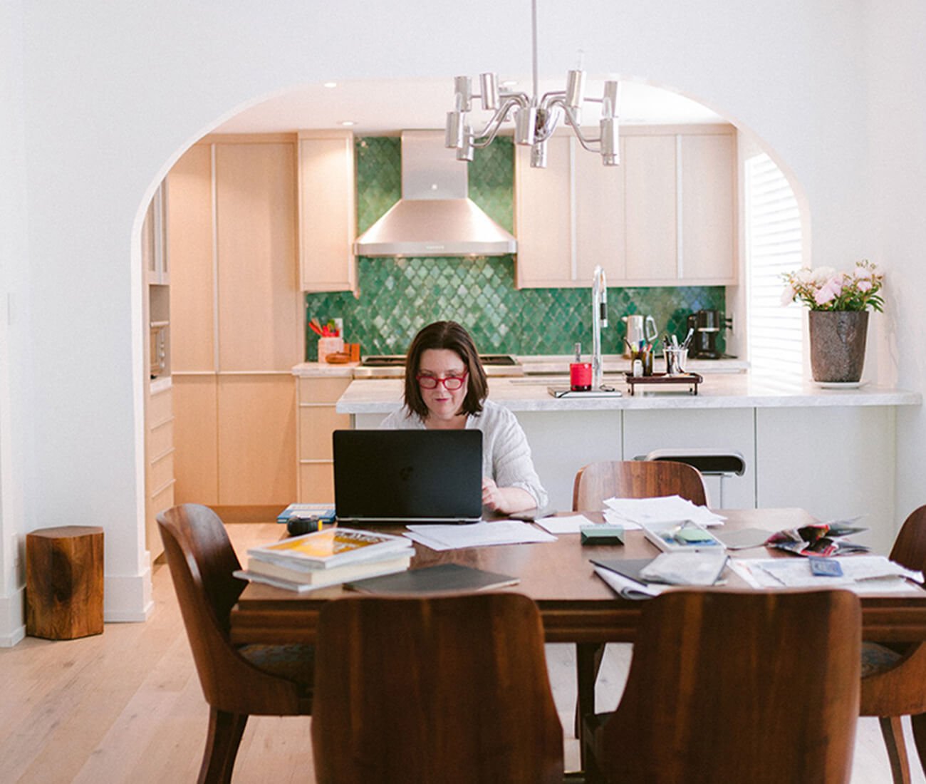 Deborah Moss, founder of Moss & Lam, working in her dining room.