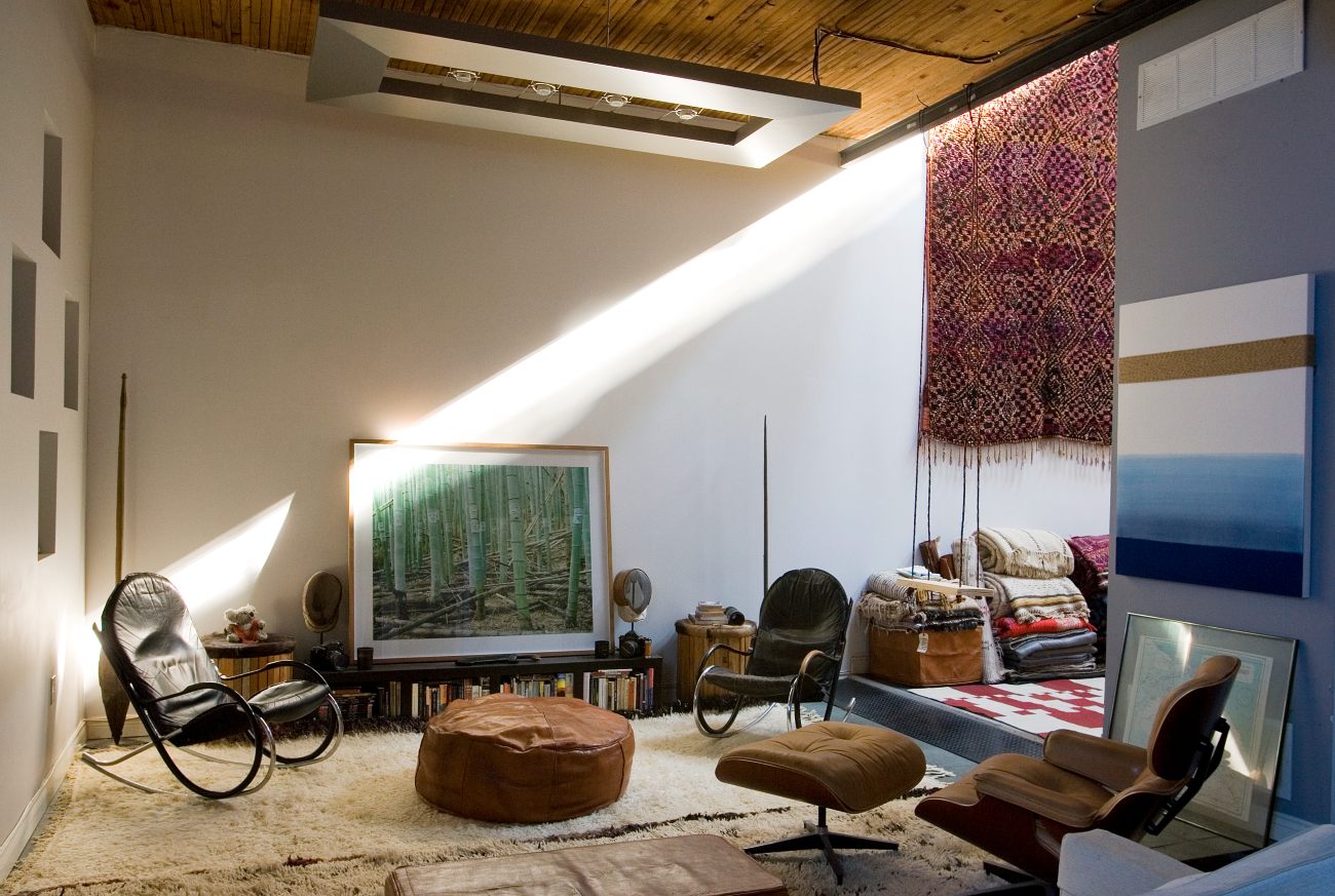 Art, vintage rugs, rocking chairs, and an Eames lounger.