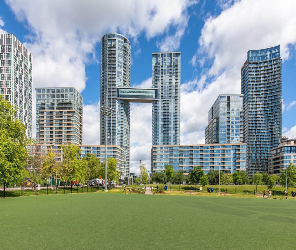 View from a park of the Skybridge condo in Toronto