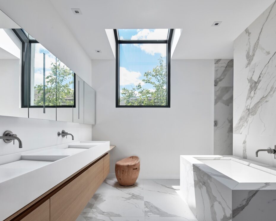 modern bathroom renovation adding a big skylight to introduce natural light