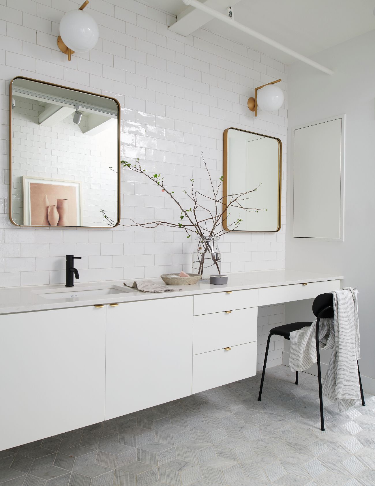 Suzanne Dimma - Custom built white bathroom vanity with two mirrors on the wall