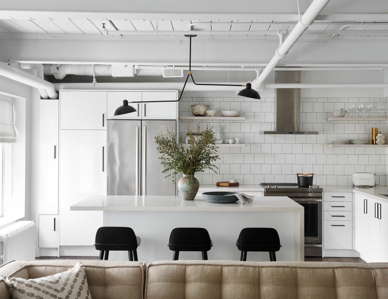 Suzanne Dimma - Kitchen white cabinetry in the renovated Warehouse