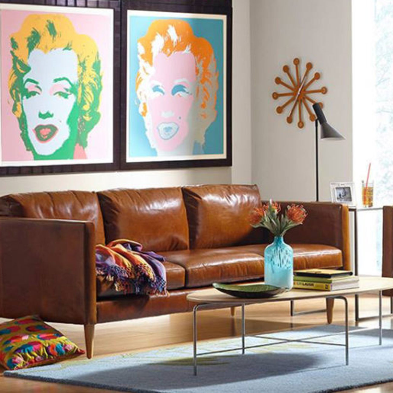 Couch and coffee table with art on the wall from Chesterfield Shop