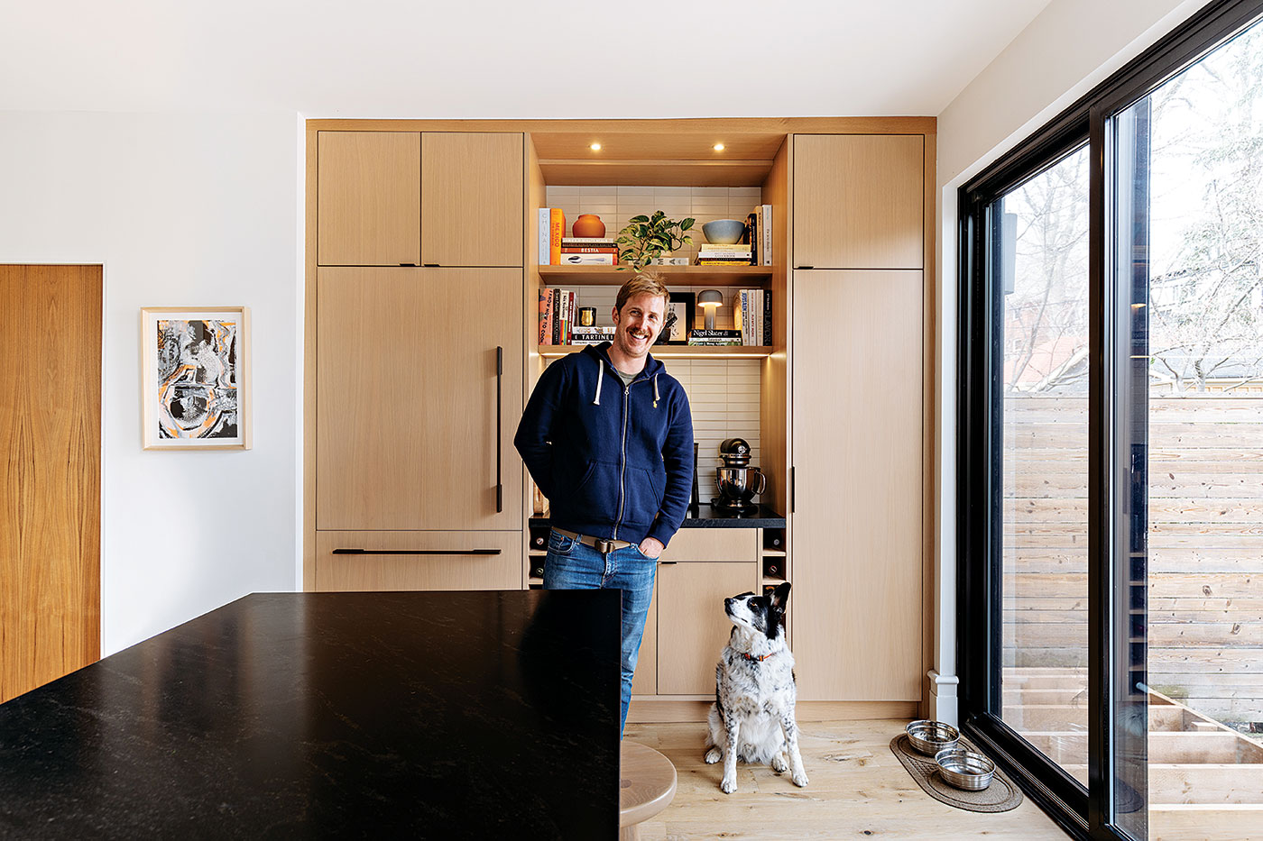 Gilles Ubaghs and dog Otis in the revamped kitchen