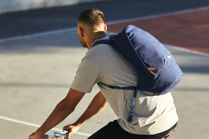 Father's Day Stylish Gifts: Blue Solid Backpack on Cyclist 