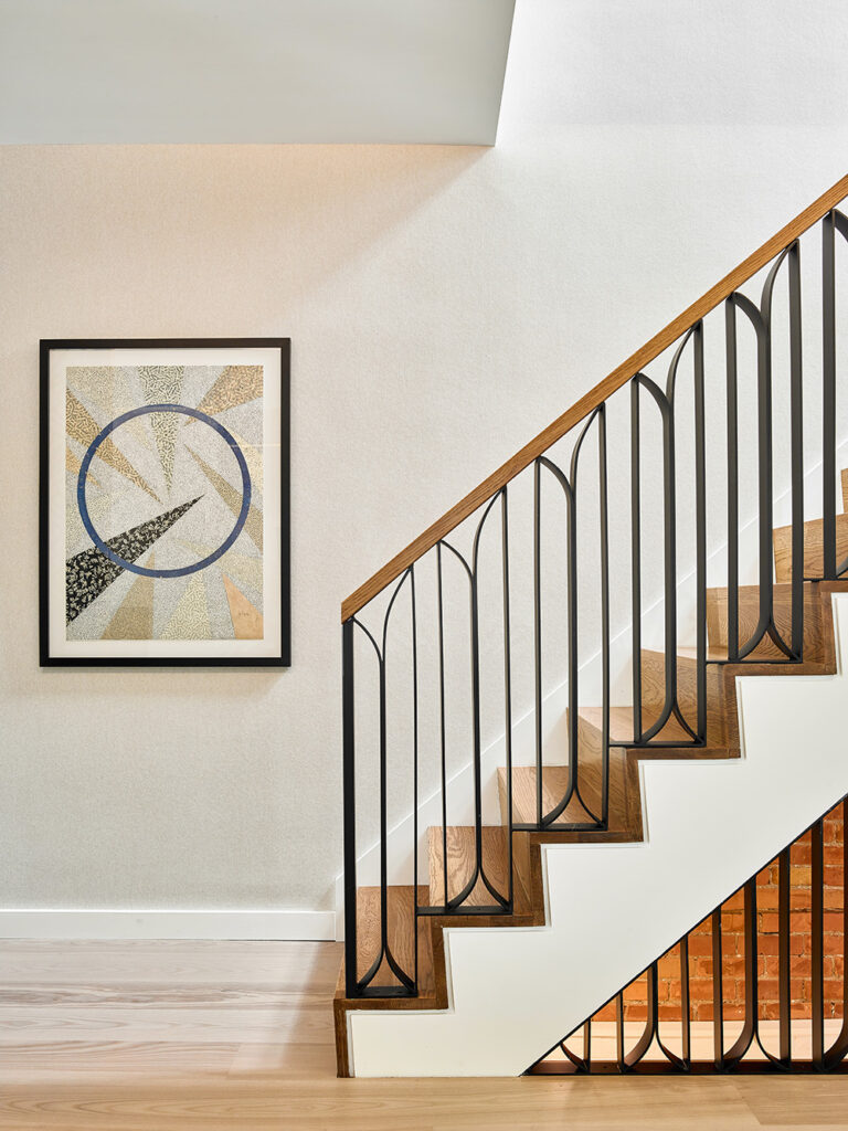 Art deco style railing on staircase in Wanda Ely's new design at Ravina House