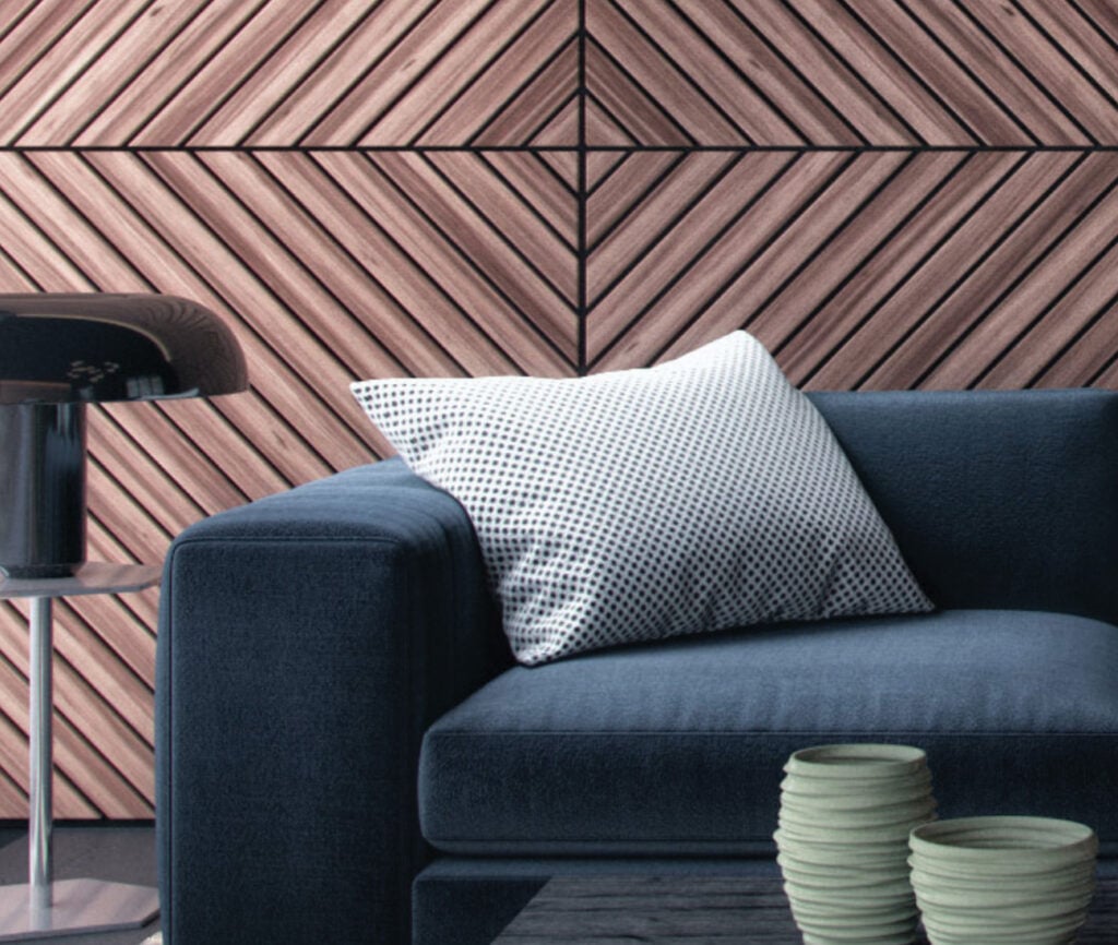Fiber Cloth showroom navy couch with white pillow in front of wooden geometric wall covering