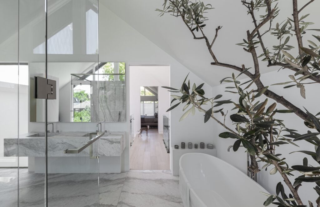 Bathroom layout with freestanding tub and marble floors